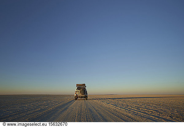 Off-road vehicle against clear sky  Makgadikgadi Pans  Botswana