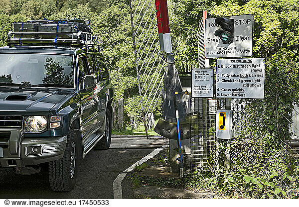 off road vehicle crossing a manual railroad crossing in the UK