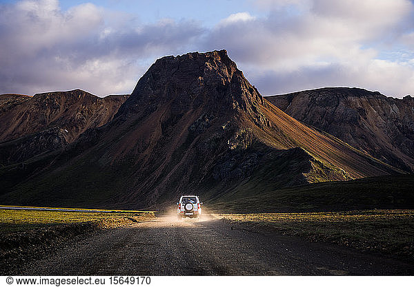 Off road vehicle driving towards mountain ranges  Landmannalaugar  Highlands  Iceland