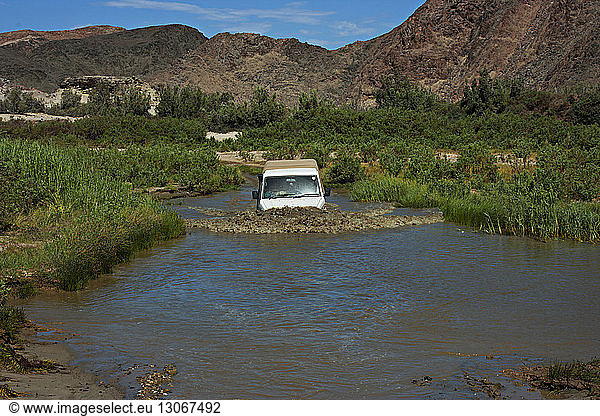 Off-road vehicle in pond