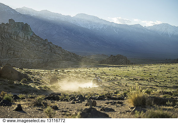 Off-road vehicle on field against Alabama Hills