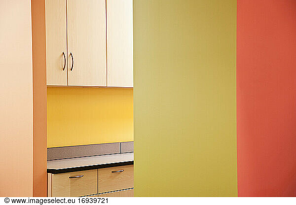 Office kitchen  empoty  colourful walls.