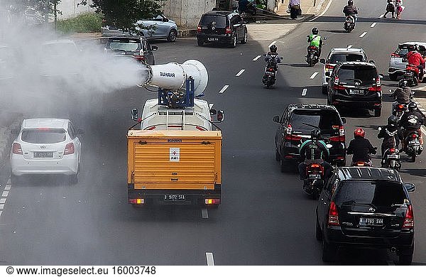 Officers were spraying disinfectants at several points on the streets in Jakarta  Indonesia. Spraying in preparation for 'New Normal' in Indonesia during the pandemic COVID-19 coronavirus. June 4  2020.