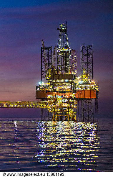 Offshore Drilling jack up rig during dusk