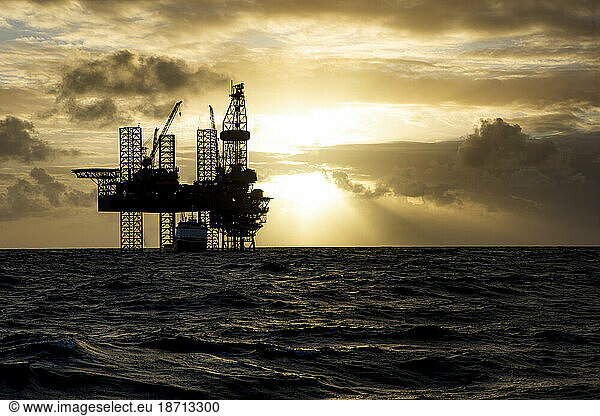 Offshore drilling platform during sunrise