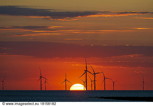 Offshore windfarm with amazing setting sun  New Brighton  Cheshire  England  United Kingdom  Europe