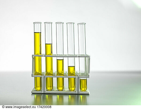 Oil in test tubes on table