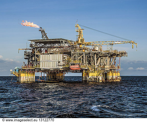 Oil production platform amidst sea