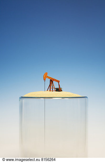 Oil pump on top of empty glass