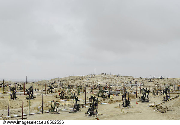 Oil rigs and wells in the Midway-Sunset shale oil fields  the largest in California