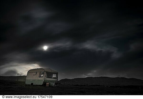 Old caravan in meadow under full moon  Beara Peninsula  Ireland  Europe