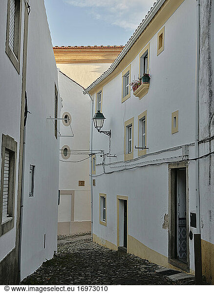 Old cobble stone lined village street in Castelo De Vide