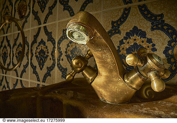 Old dirty bathroom faucet