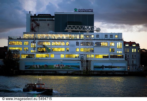 Old factory-building in the Rotterdam harbor  which is still in use by a company  transporting bulk-goods.
