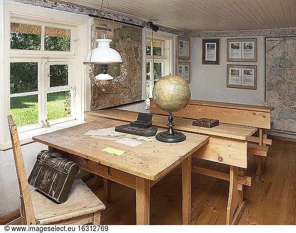 Old Fashioned Classroom in a school house  desks and oil lamps