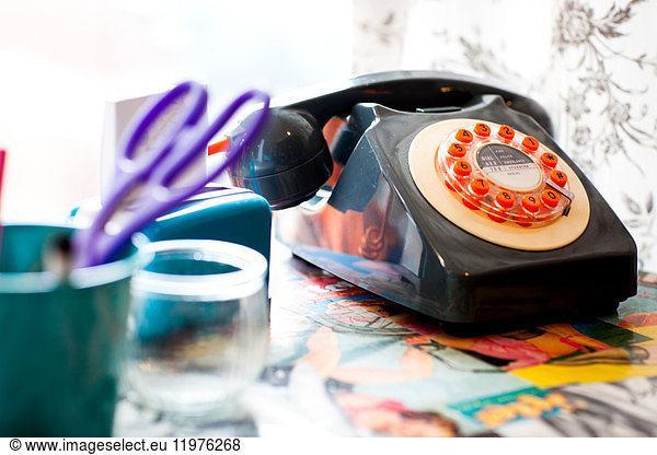 Old fashioned telephone on the reception desk of quirky hair salon