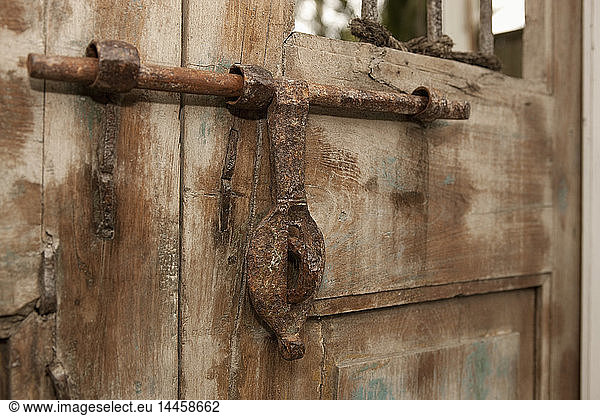 Old Iron Door Latch on Wooden Door