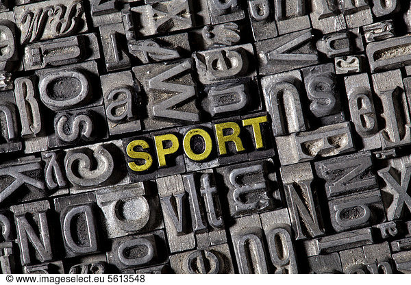 Old lead letters forming the word sport