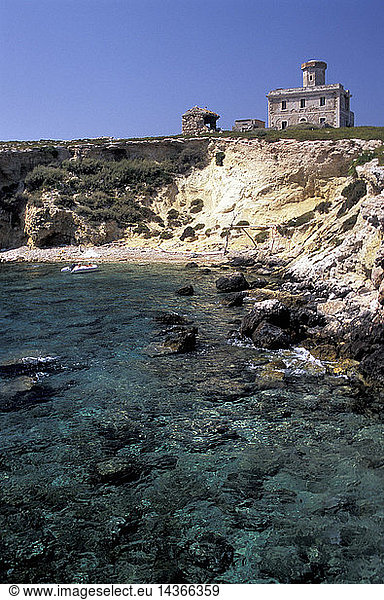 Old lighthouse and Cala dei Vermi beach  Capraia island  Tremiti Islands  Apulia  Italy