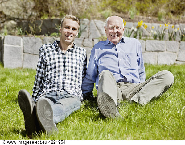 Old man and young man on lawn