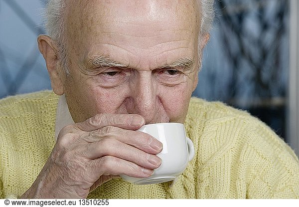Old man having a cup of coffee  Germany  Europe