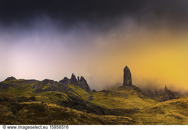 Old man storr in isle of skye with magic orange light abstract feel