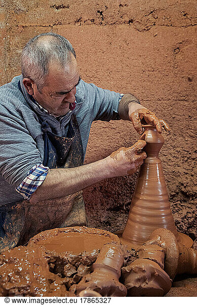 old man work the clay