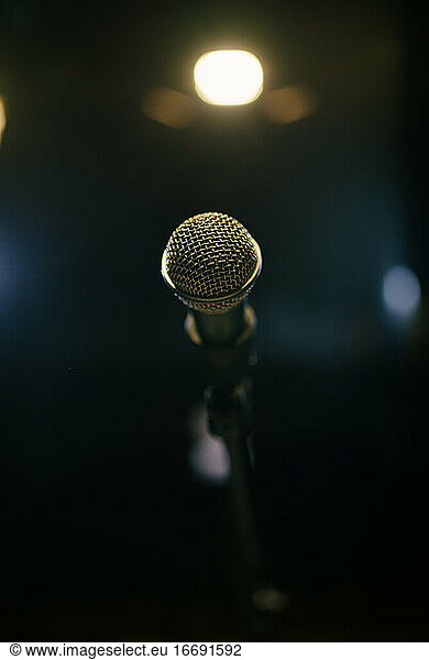 Old microphone on stage closeup.