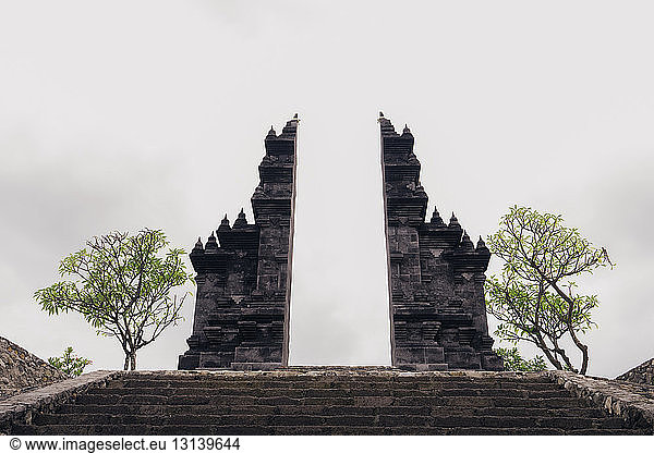 Old ruin of temple against sky at Bali