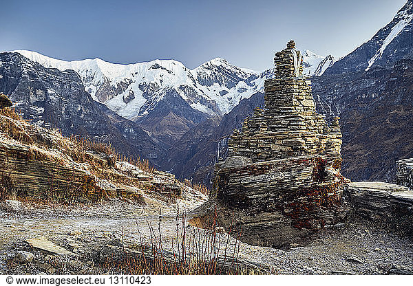 Old ruin stupa on Mardi Himal trek against clear sky during winter