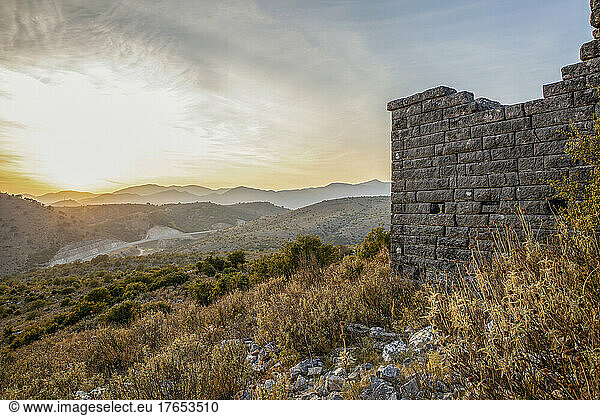 Old ruins at archaeological site with mountains in background  Orraon  Arta  Greece