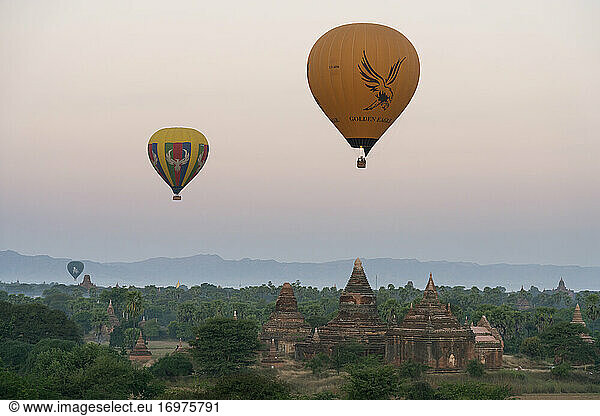 Old temple in Bagan and hot-air balloons before sunrise  UNESCO  Old Bagan  Mandalay Region  Myanmar