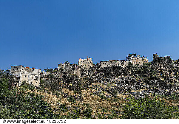 Old village on Asir mountain under blue sky