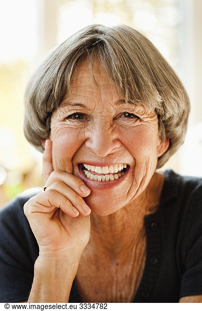 Old woman smiling at viewer