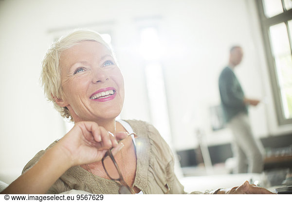 Older woman smiling indoors