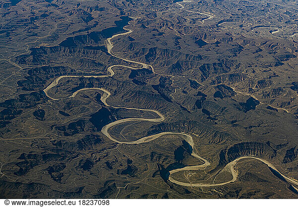 Oman  Dhofar Governorate  Aerial view of dry riverbed in winding canyon