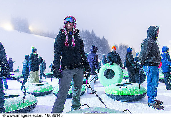 One adult female gets ready to go tubing in Oregon.
