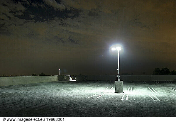 One light lighting an empty parking lot in Los Angeles.