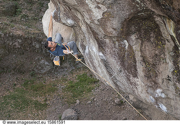 One man holding a rope while rock climbing in Jilotepec  Mexico