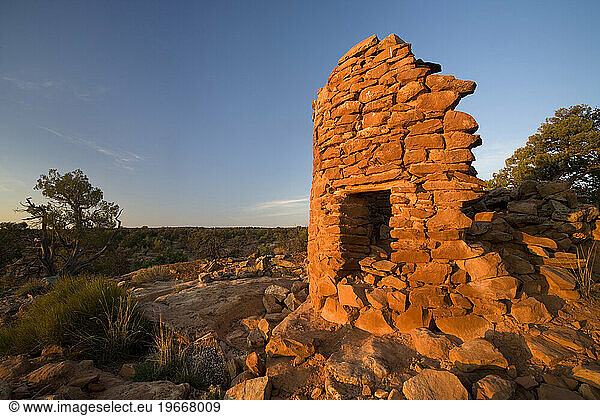 One of the Mule Canyon Tower indian ruins at sunrise in the Cedar Mesa area of Utah.