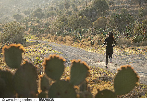 One runner on a dirt road Puebla  Mexico.