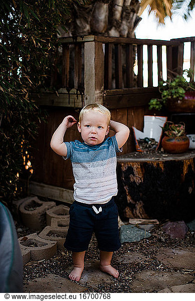 One Year Old Boy Standing on Rocks in Yard in San Diego
