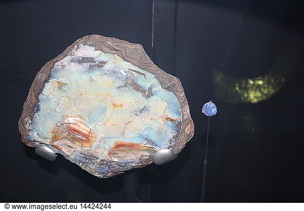 Opal. Today this is valued as a semi-precious stone but this coloured opal was used in ancient Rome as a symbol of power. An Opal is not a single crystal but is made up of tiny spheres of silica. It also contains water and can dry out and crack  particularly if exposed to heat.