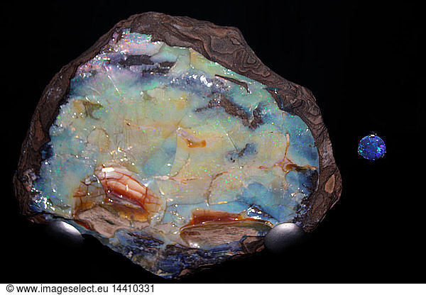 Opal. Today this is valued as a semi-precious stone but this rainbow coloured opal was used in ancient Rome as a symbol of power. An Opal is not a single crystal but is made up of tiny spheres of silica. It also contains water and can dry out and crack  especially if exposed to heat.