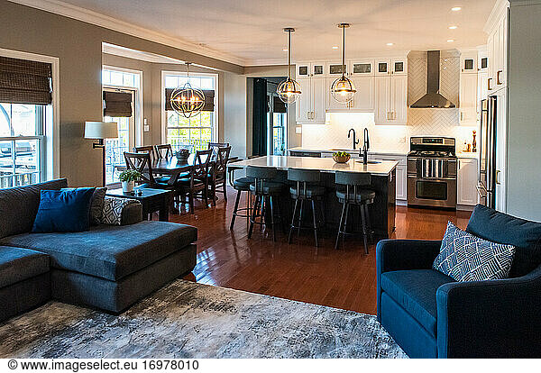 Open concept modern transitional living room and kitchen in a home.