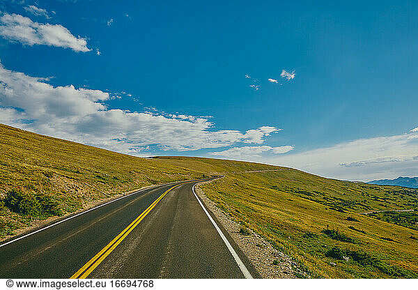 Open highway through Rocky Mountains National Park in Colorado.