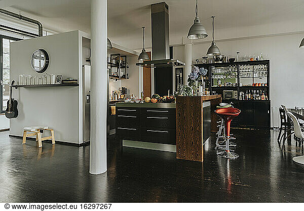 Open-plan kitchen and bar in a designer loft
