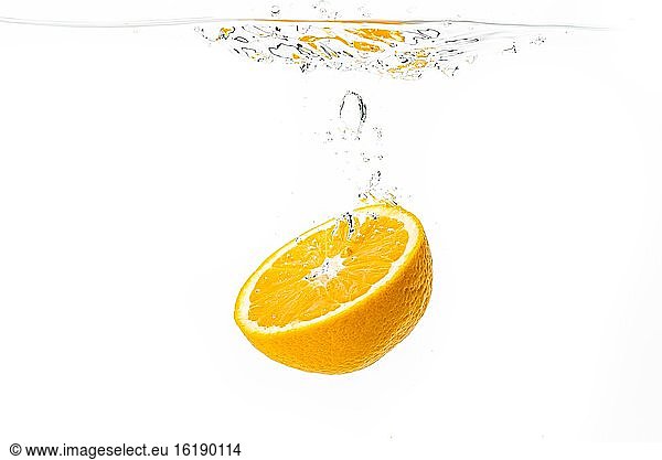 Orange falls into the water  studio shot  cutout  Austria  Europe