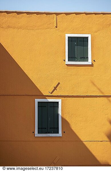 Orange house wall with windows  closed shutters  colorful house wall  colorful facade  Burano Island  Venice  Veneto  Italy  Europe