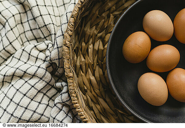 Organic Brown Eggs in Brown Bowl and Basket